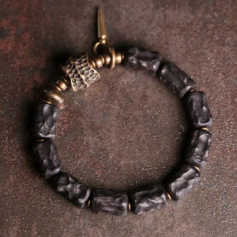 Braccialetto di coppia di protezione dell'equilibrio in legno di ebano e rame Buddha Stones