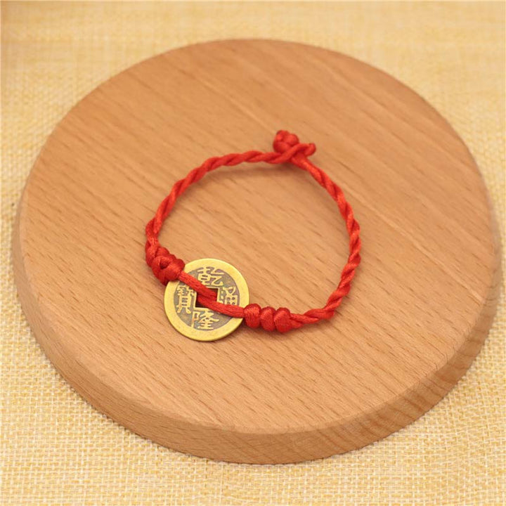 Braccialetto intrecciato con corda rossa, moneta di rame e Buddha Stones
