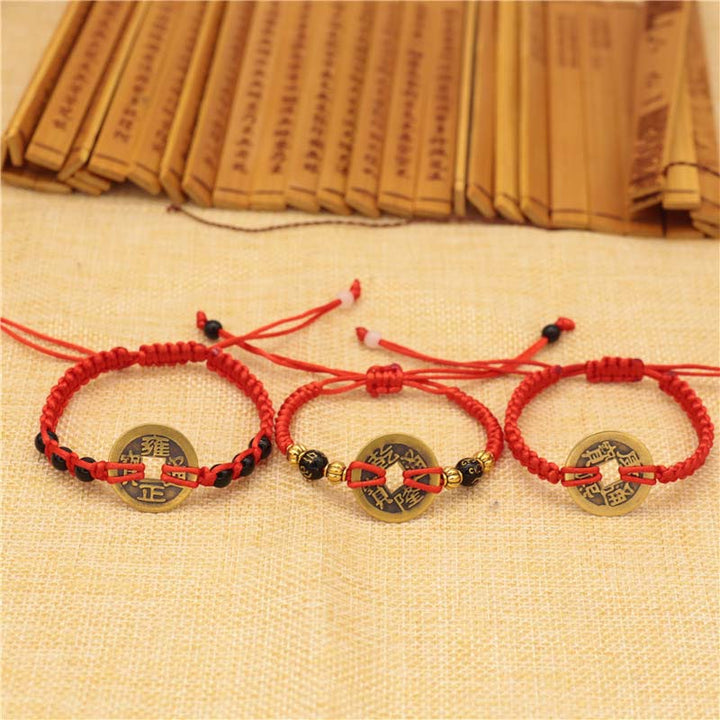 Braccialetto intrecciato con corda rossa, moneta di rame e Buddha Stones