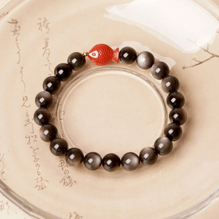 Braccialetto di protezione lenitiva con pesce koi, ossidiana, cinabro, argento naturale e Buddha Stones