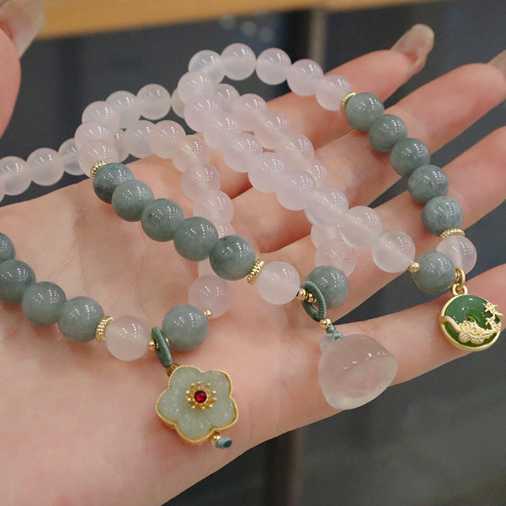 Braccialetto di protezione con fibbia della pace, fiore di loto, agata bianca e giada Buddha Stones