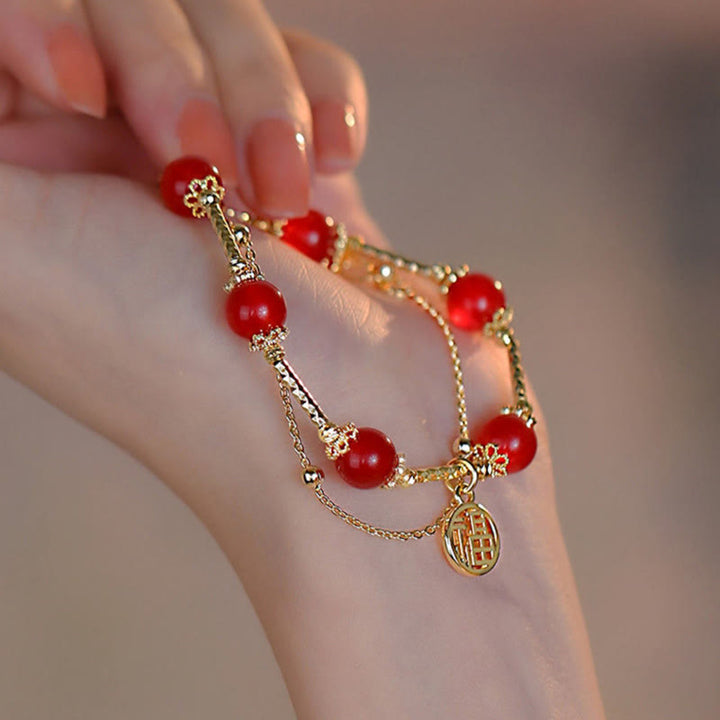 Braccialetto di accettazione di sé con ciondolo a forma di carattere Fu in agata rossa Buddha Stones