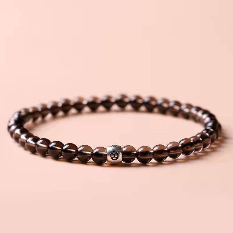 Bracciale Buddha Stones in ossidiana nera naturale e quarzo fumé per la forza di purificazione