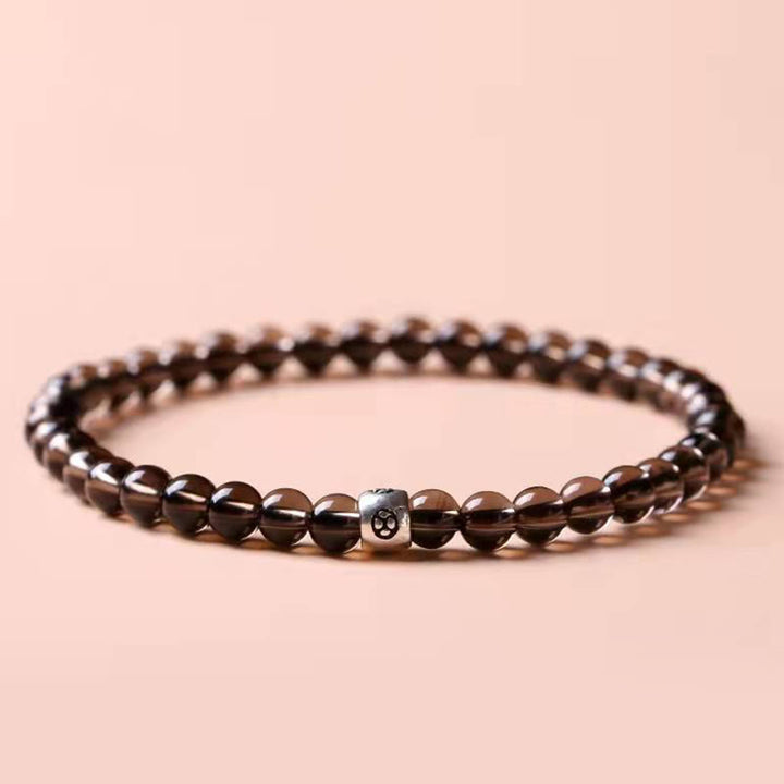 Bracciale Buddha Stones in ossidiana nera naturale e quarzo fumé per la forza di purificazione