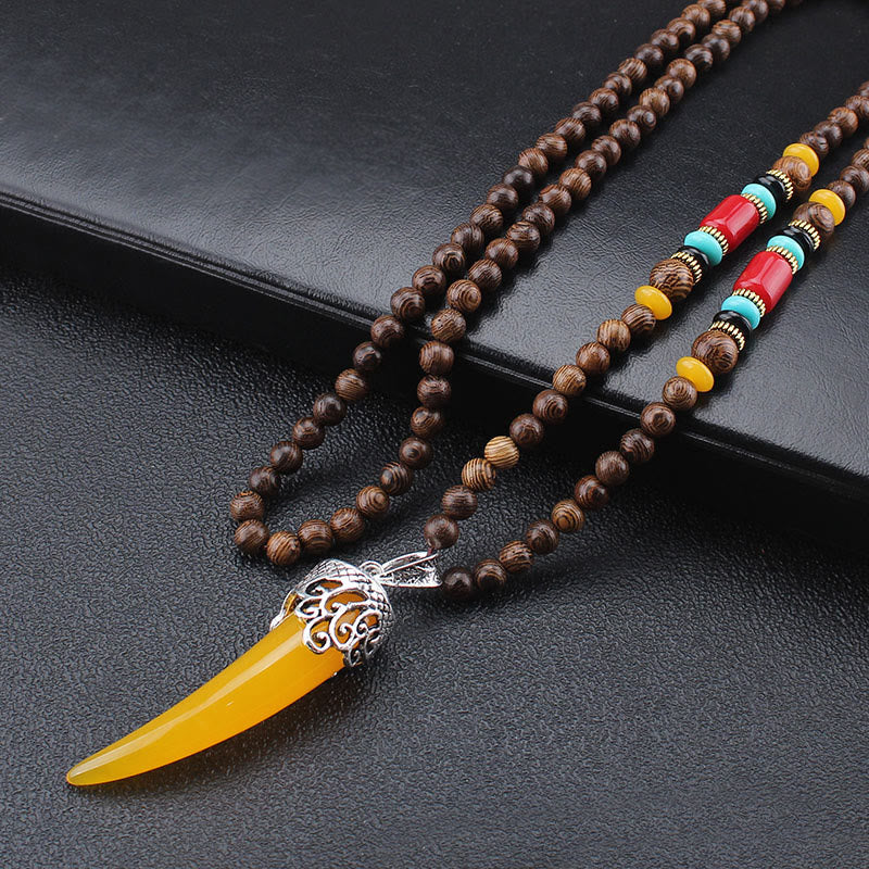Collana con ciondolo in stile corno in pietra turchese e legno wenge, protezione e meditazione
