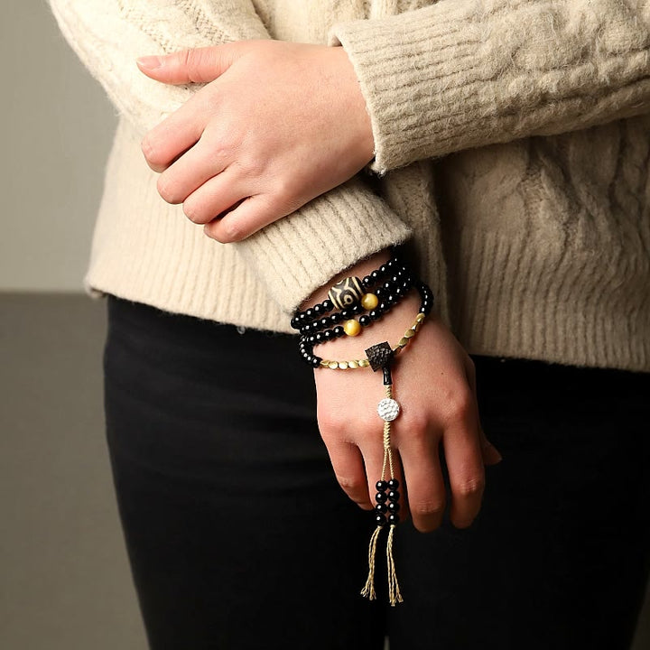 Buddha Stones Tibetano 108 Mala Beads Onice Nero Tre Occhi Dzi Beads Bracciale di Protezione