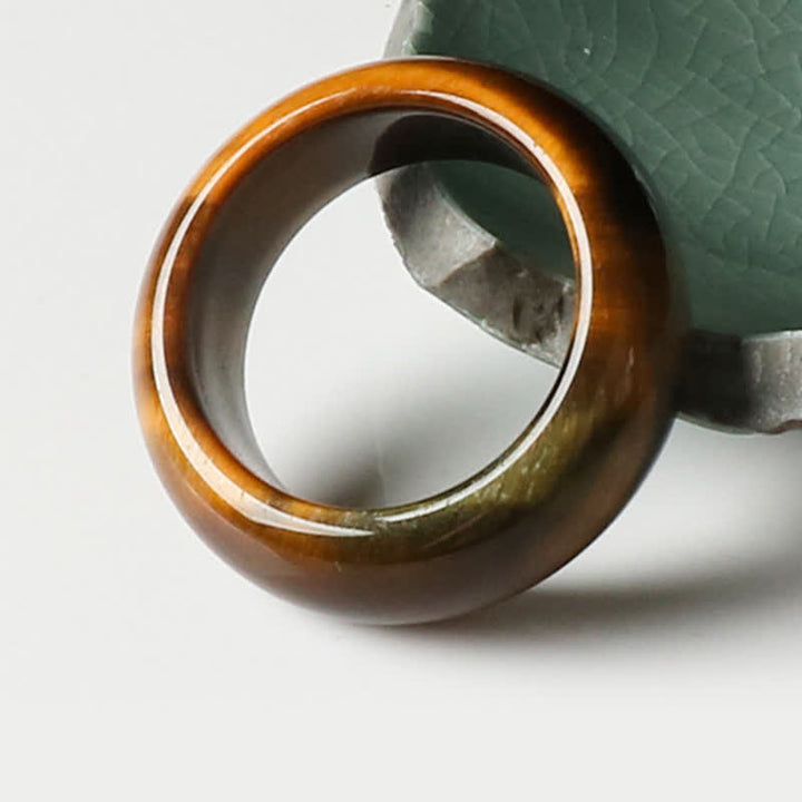 Anello di protezione della forza della pietra dell'occhio di tigre Buddha Stones
