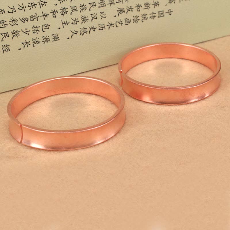 Bracciale rigido in rame con simbolo di ricchezza e fortuna