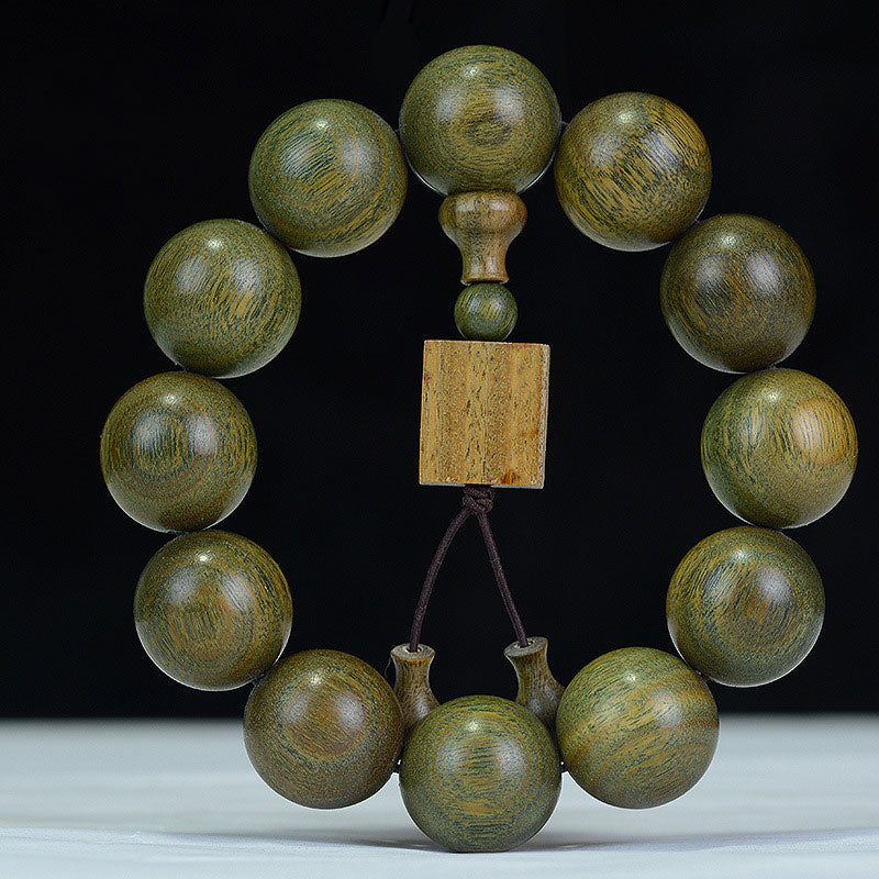 Braccialetto di cura in legno di sandalo verde tibetano Buddha Stones
