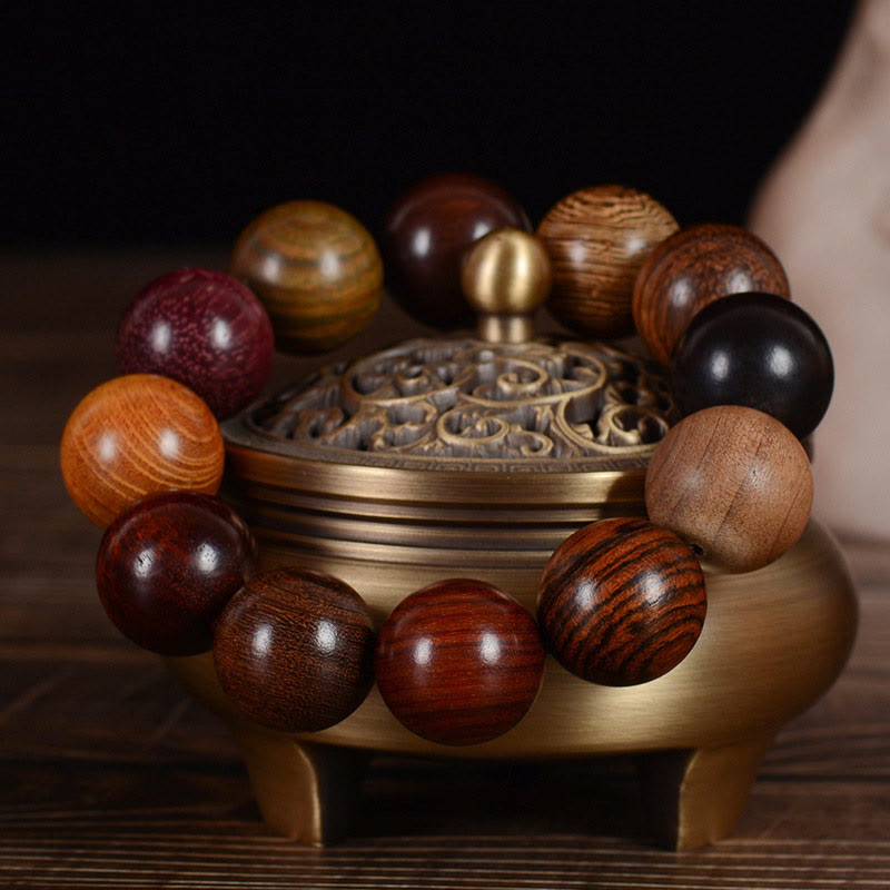 Braccialetto di guarigione di protezione multicolore in legno di sandalo Buddha Stones