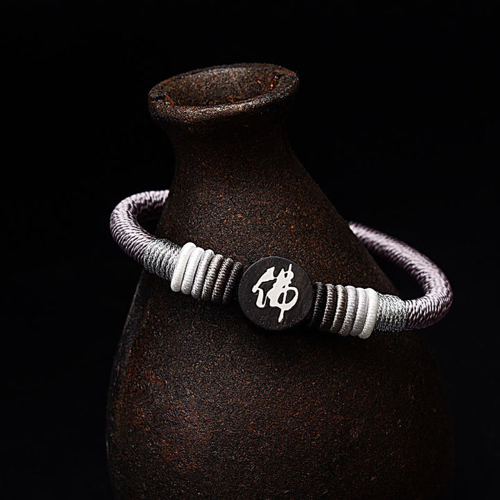 Braccialetto in corda artigianale in ebano con carattere Buddha Stones Buddha