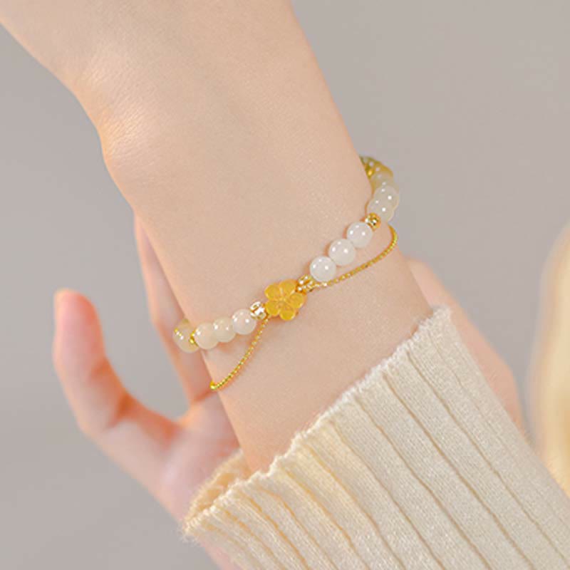 Bracciale Buddha Stones in argento sterling 925 con giada naturale Hetian e fiori di pesco