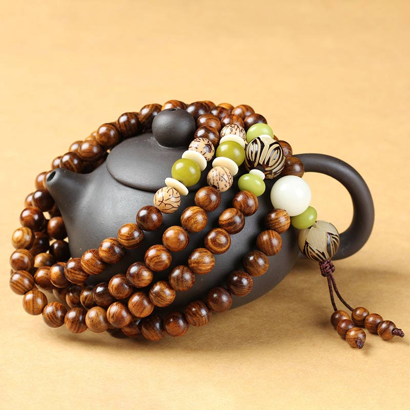 Braccialetto di protezione e calma Mala in palissandro tibetano Buddha Stones
