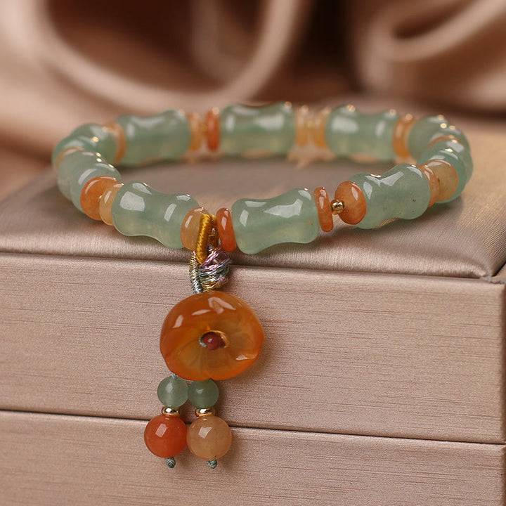 Braccialetto della fortuna con motivo a fiori di bambù e giada naturale Buddha Stones