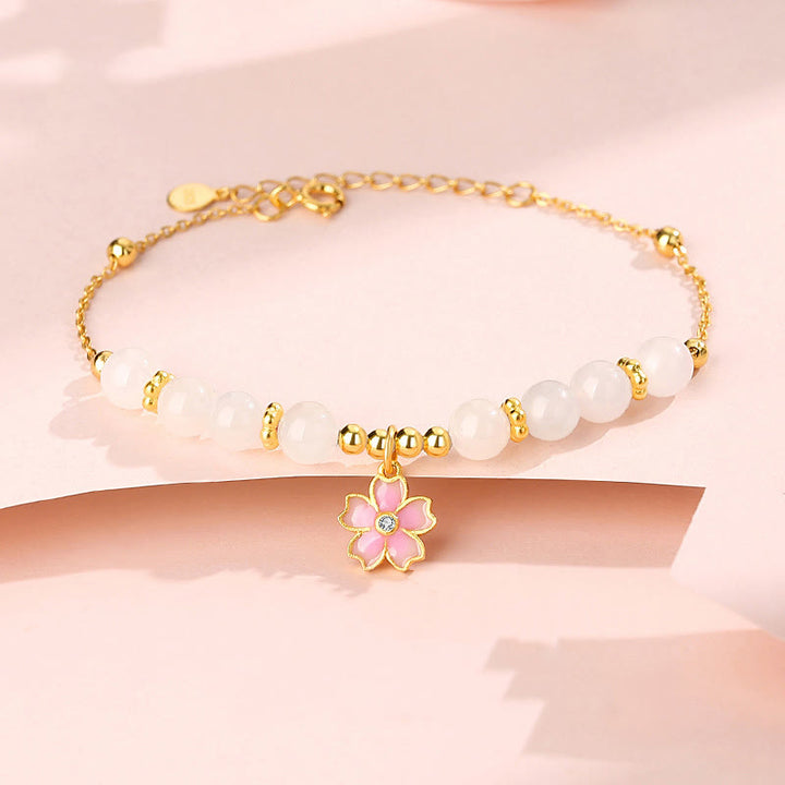 Braccialetto di protezione in giada bianca Hetian con fiori di ciliegio in argento sterling 925 Buddha Stones