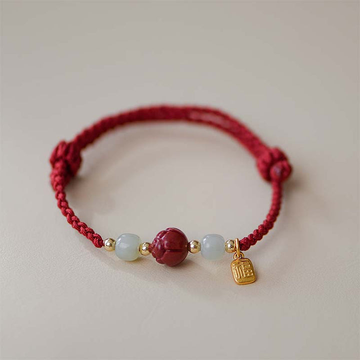 Braccialetto intrecciato con corda rossa calma, giada, cinabro e loto Buddha Stones