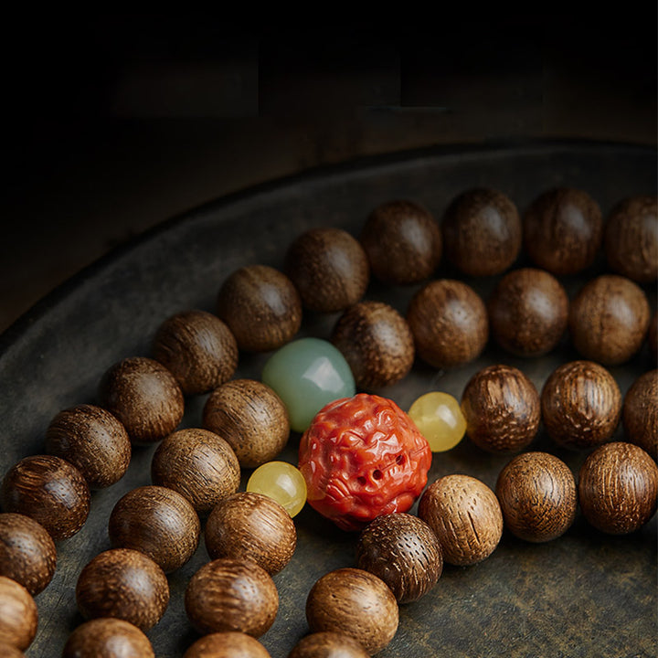Buddha Stones 108 perle di Mala Kalimantan Agarwood Zucca Giada Ambra Bracciale equilibrio