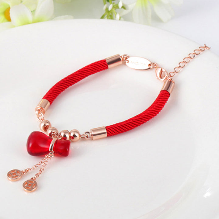 Braccialetto Buddha Stones Wealth Attractor con corda rossa e agata rossa