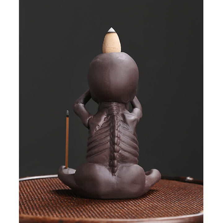 Buddha Stones Piccolo teschio Fantasma Argilla viola Fontana di fumo a riflusso Bruciatore di incenso della pace Decorazione