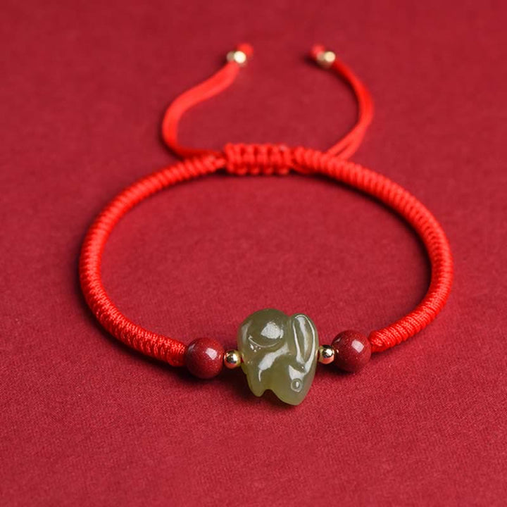 Braccialetto di corda dell'abbondanza di perline di cinabro con coniglietto di giada di Hetian dell'anno del coniglio