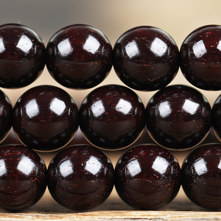 Braccialetto di protezione con nodo cinese in legno di sandalo rosso con piccola foglia e stella d'oro Buddha Stones