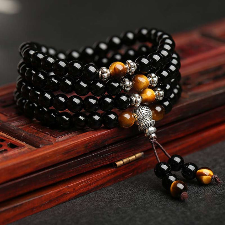 Bracciale Mala di benedizione con occhio di tigre e ossidiana nera Buddha Stones