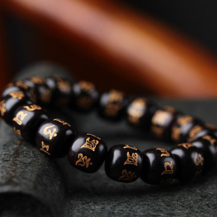 Braccialetto della pace inciso Buddha Stones in legno di ebano tibetano Om Mani Padme Hum