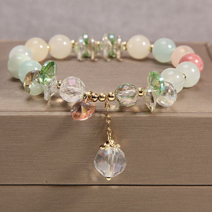 Braccialetto con ciondolo di pace in cristallo rosa con occhio di gatto Buddha Stones
