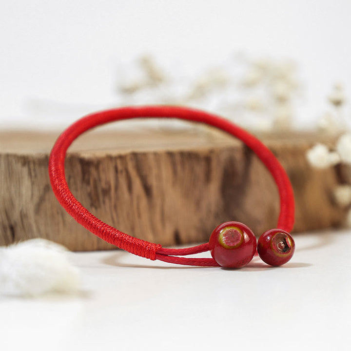 Braccialetto in ceramica con corda rossa portafortuna FengShui Buddha Stones