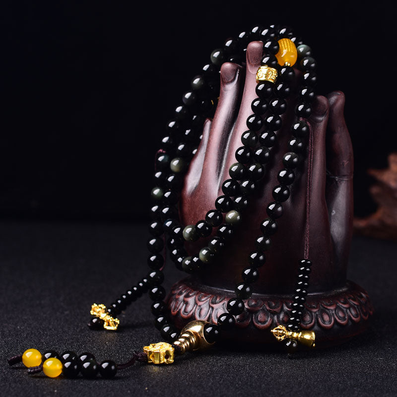 Braccialetto Mala Buddha Stones 108 perle in ossidiana nera naturale Lotus Fulfilment
