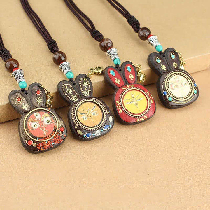Collana pendente Thangka con cinque divinità della ricchezza in ebano tibetano