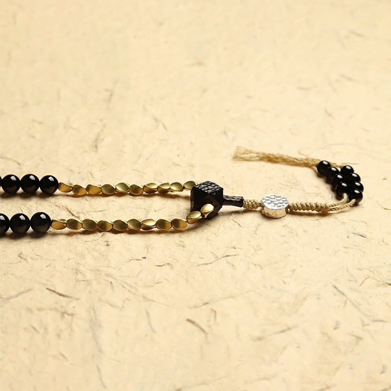 Buddha Stones Tibetano 108 Mala Beads Onice Nero Tre Occhi Dzi Beads Bracciale di Protezione