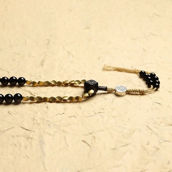 Buddha Stones Tibetano 108 Mala Beads Onice Nero Tre Occhi Dzi Beads Bracciale di Protezione