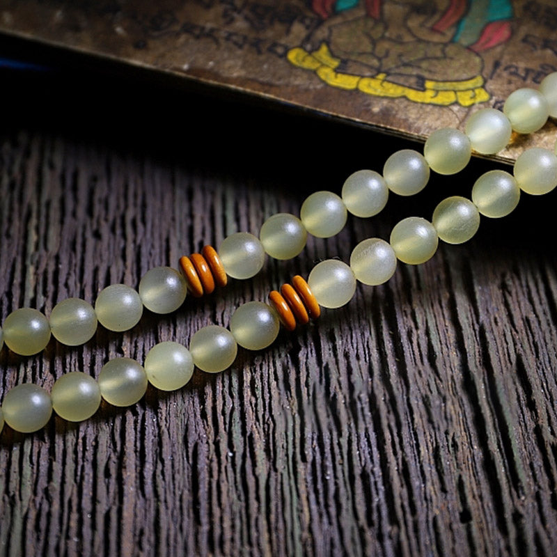 Braccialetto della fortuna in ambra e corno di pecora del Tibet con 108 perle di Mala Buddha Stones