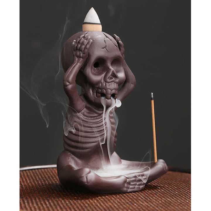 Buddha Stones Piccolo teschio Fantasma Argilla viola Fontana di fumo a riflusso Bruciatore di incenso della pace Decorazione