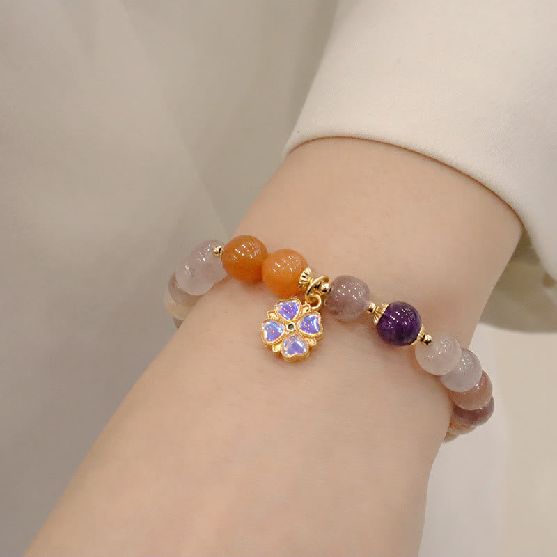 Braccialetto di perline con ciondolo a forma di fiore viola dorato naturale di seta Buddha Stones