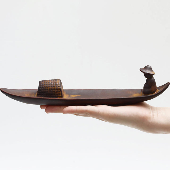 Buddha Stones Un pescatore solitario a galla Bruciatore di incenso curativo in ceramica