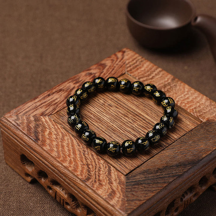 Braccialetto di meditazione Om Mani Padme Hum in onice nero e cristallo bianco del Tibet Buddha Stones