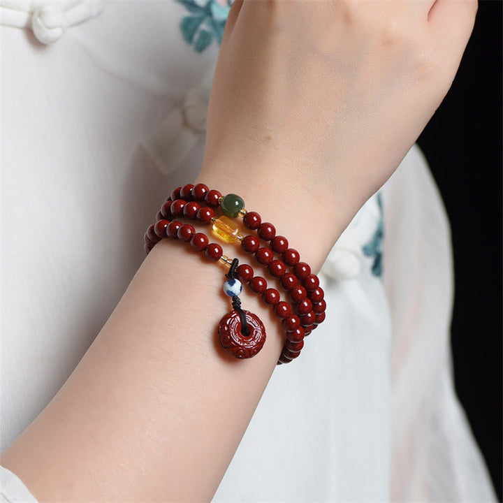 Braccialetto di benedizione a triplo giro con fibbia della pace in cinabro tibetano Buddha Stones Mala