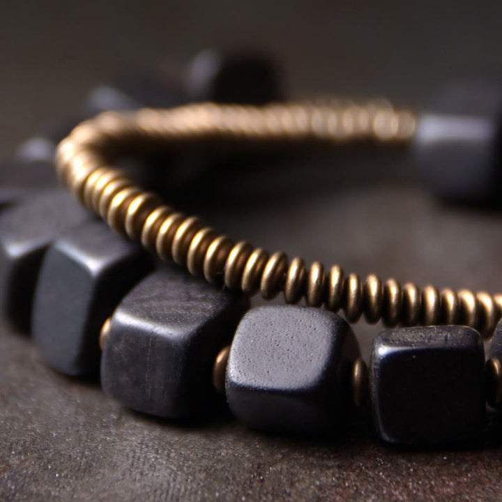 Braccialetto doppio giro in legno di ebano tibetano di Buddha Stones e rame