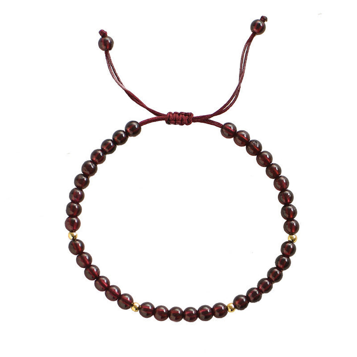 Braccialetto di stabilità con perline dorate e granato naturale Buddha Stones