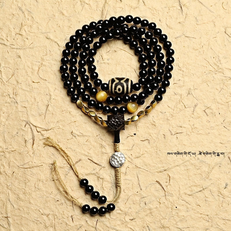 Buddha Stones Tibetano 108 Mala Beads Onice Nero Tre Occhi Dzi Beads Bracciale di Protezione