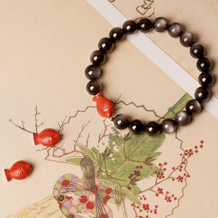 Braccialetto di protezione lenitiva con pesce koi, ossidiana, cinabro, argento naturale e Buddha Stones