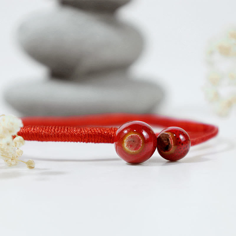 Braccialetto in ceramica con corda rossa portafortuna FengShui Buddha Stones