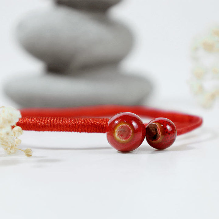 Braccialetto in ceramica con corda rossa portafortuna FengShui Buddha Stones
