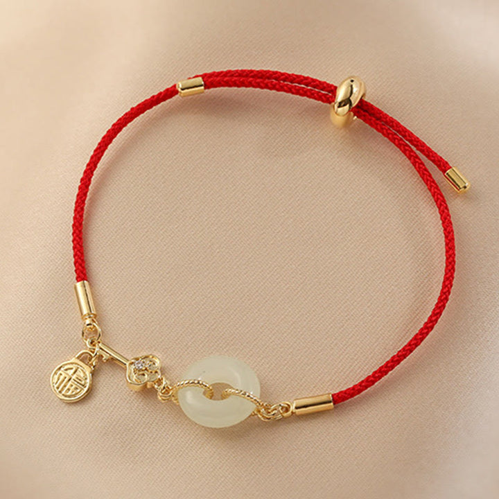 Braccialetto in corda rossa con fibbia della pace in giada Hetian placcato oro 18K con carattere Fu e Buddha Stones