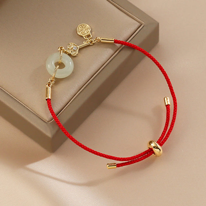 Braccialetto in corda rossa con fibbia della pace in giada Hetian placcato oro 18K con carattere Fu e Buddha Stones