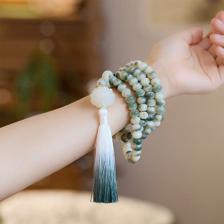 Buddha Stones naturali 108 perle Mala Bodhi Seed Lotus inciso braccialetto di saggezza nappa