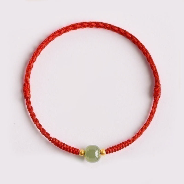 Bracciale intrecciato con Buddha Stones e portafortuna
