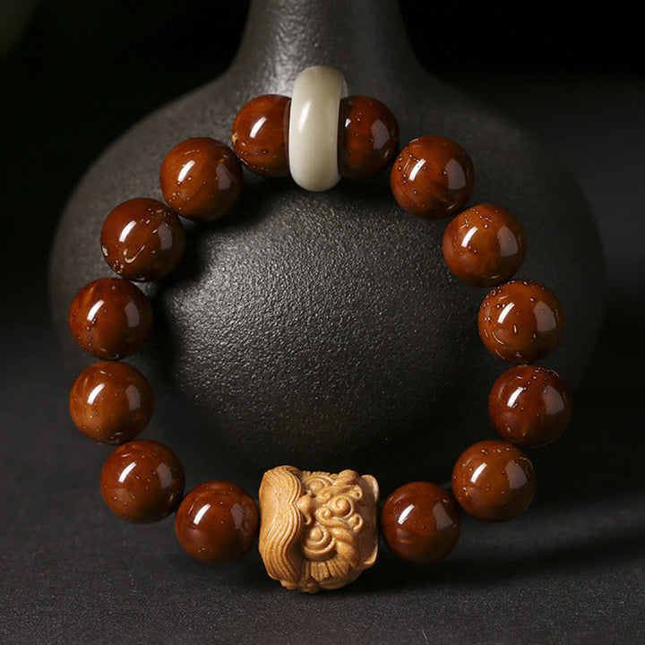 Braccialetto della saggezza del leone danzante dei semi di Bodhi viola Buddha Stones